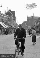 Man Cycling In The High Street c.1955, Grays