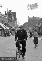 Man Cycling In The High Street c.1955, Grays