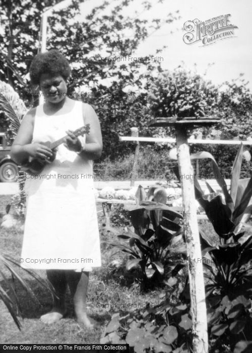 Photo of Hawaii, Honolulu, A Woman Playing Ukelele  c.1935