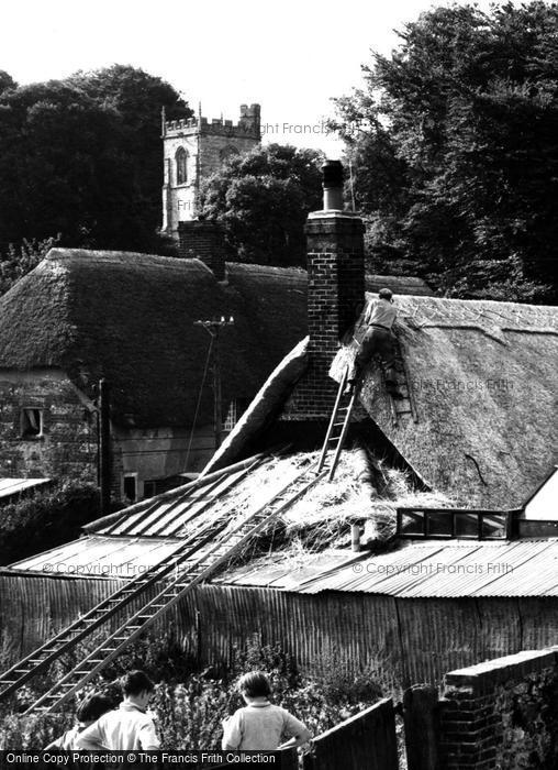 Photo of Hilton, Thatcher At Work In The Village c.1955