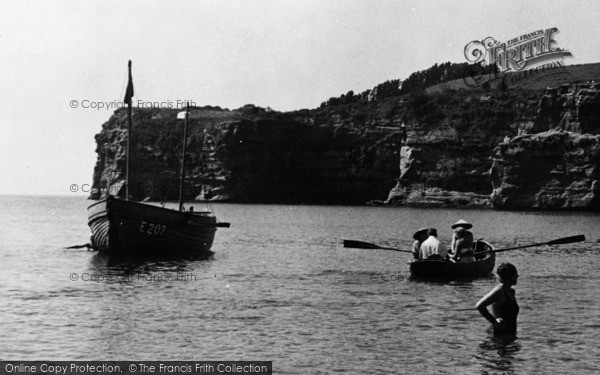 Photo of Ladram Bay, A Bather And Rowing Boat c.1955