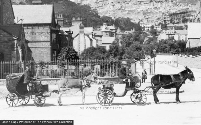 Photo of Llandudno, Donkey Carts In Gloddaeth Street 1890