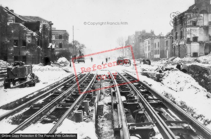 Photo of London, Bomb Damaged Tram Tracks In The Snow c.1940