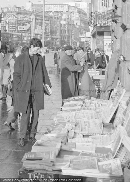 Photo of London, Piccadilly, Reading Headlines 1964
