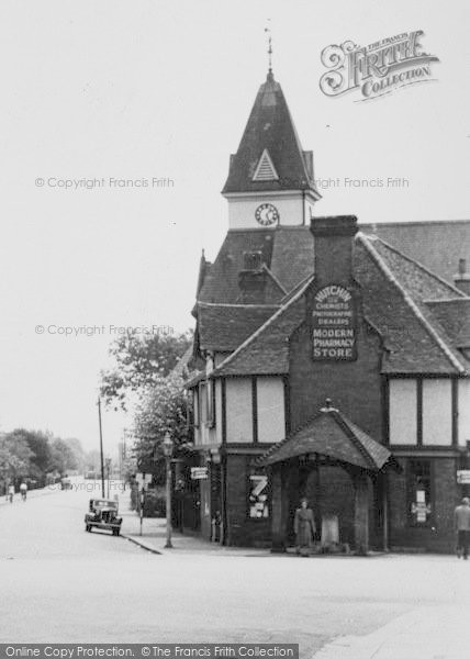 Photo of Loughton, Chemists, And Lopping Hall Clock Tower c.1955