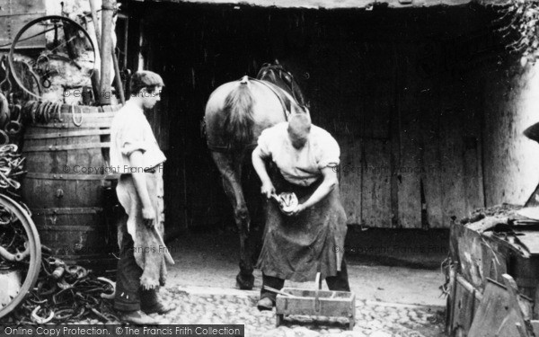 Photo of Lyme Regis, A Farrier Shoeing A Horse 1909