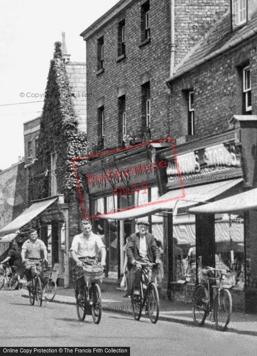 Photo of March, Cycling On High Street c.1955