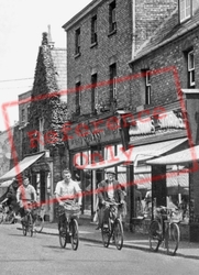 Cycling On High Street c.1955, March
