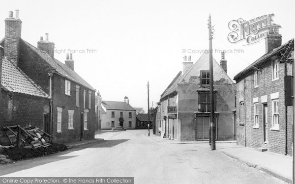 Photo of North Frodingham, The Post Office And Cross c.1955