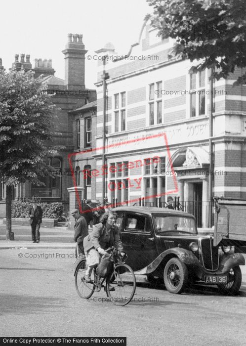 Photo of Redditch, Lady Cycling On The Parade c.1950