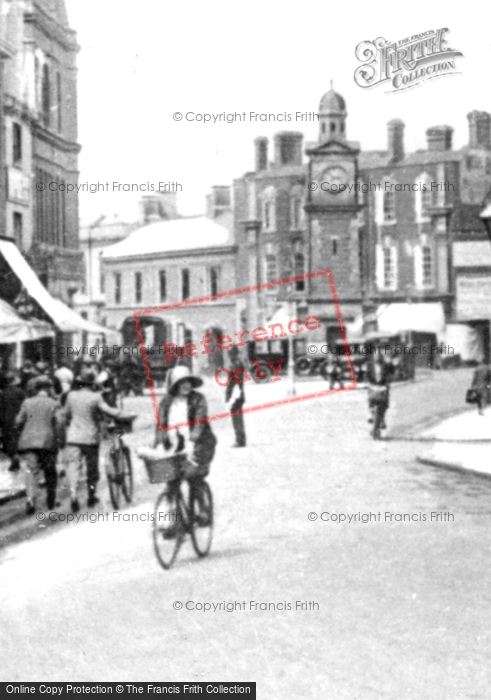 Photo of Rugby, Cyclists In Market Place 1932
