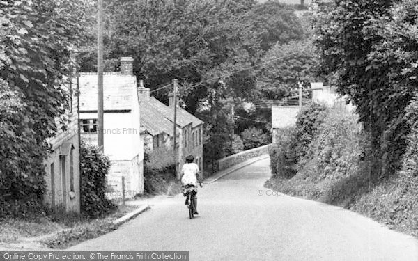 Photo of St Columb Major, Woman Cycling Down Bridge Hill c.1955