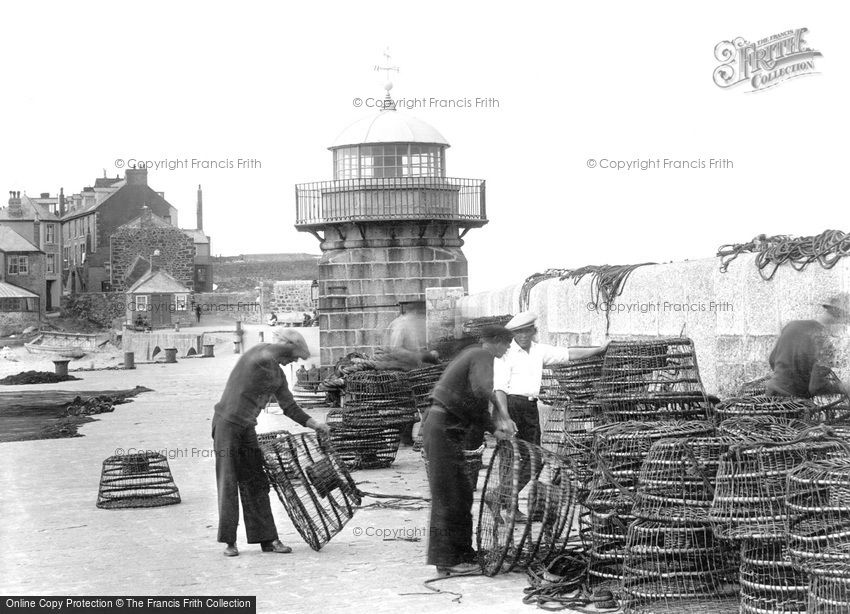 St Ives, Fishermen checking lobster pots at Smeaton's Pier 1925