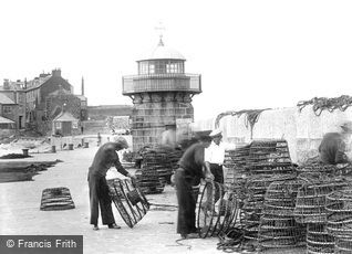 St Ives, Fishermen checking lobster pots at Smeaton's Pier 1925