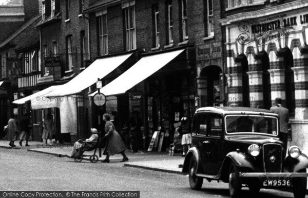 Photo of St Neots, Pushing A Wheelchair, High Street c.1955
