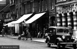 Pushing A Wheelchair, High Street c.1955, St Neots
