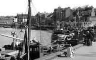 Men Sitting On Mooring Bollard c.1960, Whitby