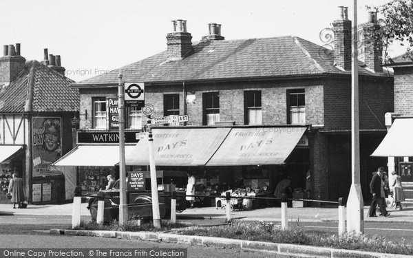 Photo of Woodford Bridge, Shops, The High Road c.1955
